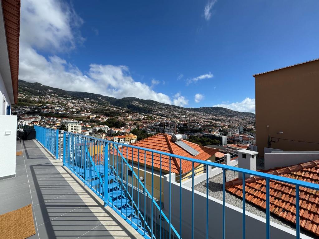 a balcony with a view of a city at Stayin Arrifes I C in Funchal
