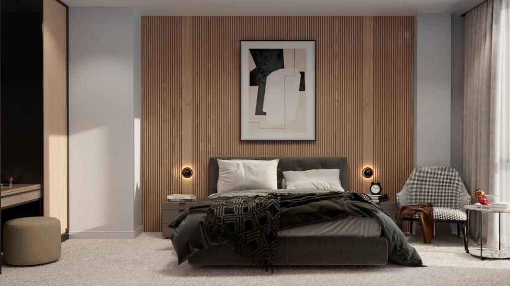 a bedroom with a bed and a picture on the wall at IDEA Collection by GINO Hotels in Tbilisi City