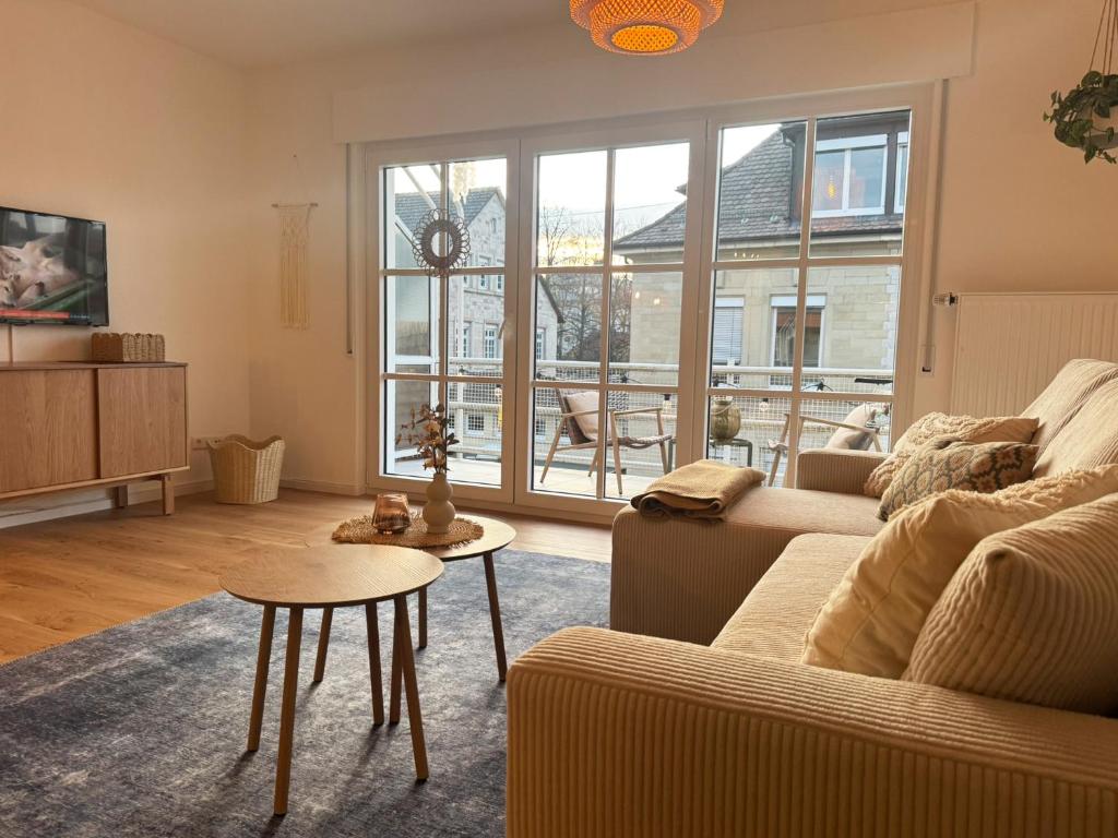a living room with a couch and a table at MurgLoge Gaggenau in Gaggenau
