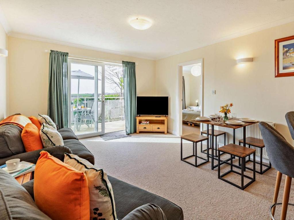 a living room with a couch and a table at 2 Bed in Bude oc-87225 in Kilkhampton