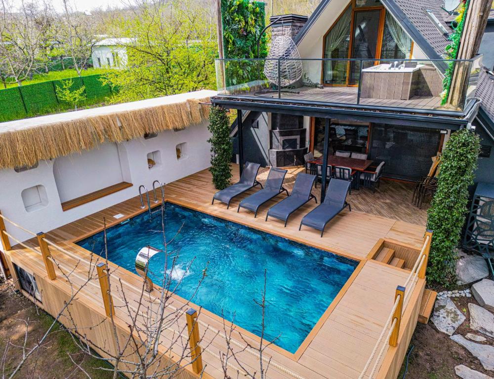 an overhead view of a house with a swimming pool at Shore of Sapanca Lake Çatı Villa Lakehouse in Kartepe