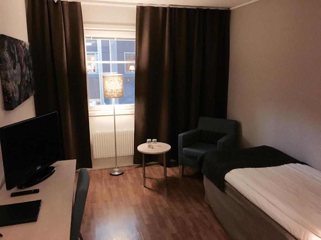 Postel nebo postele na pokoji v ubytování Hotell Vilja