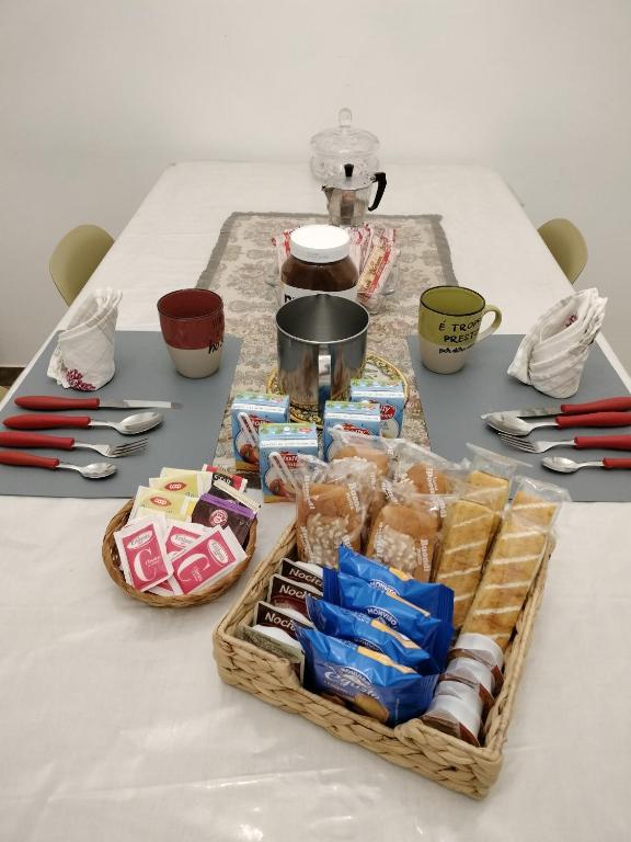 a table with a basket of food and utensils at S'Agapò in Torre del Greco
