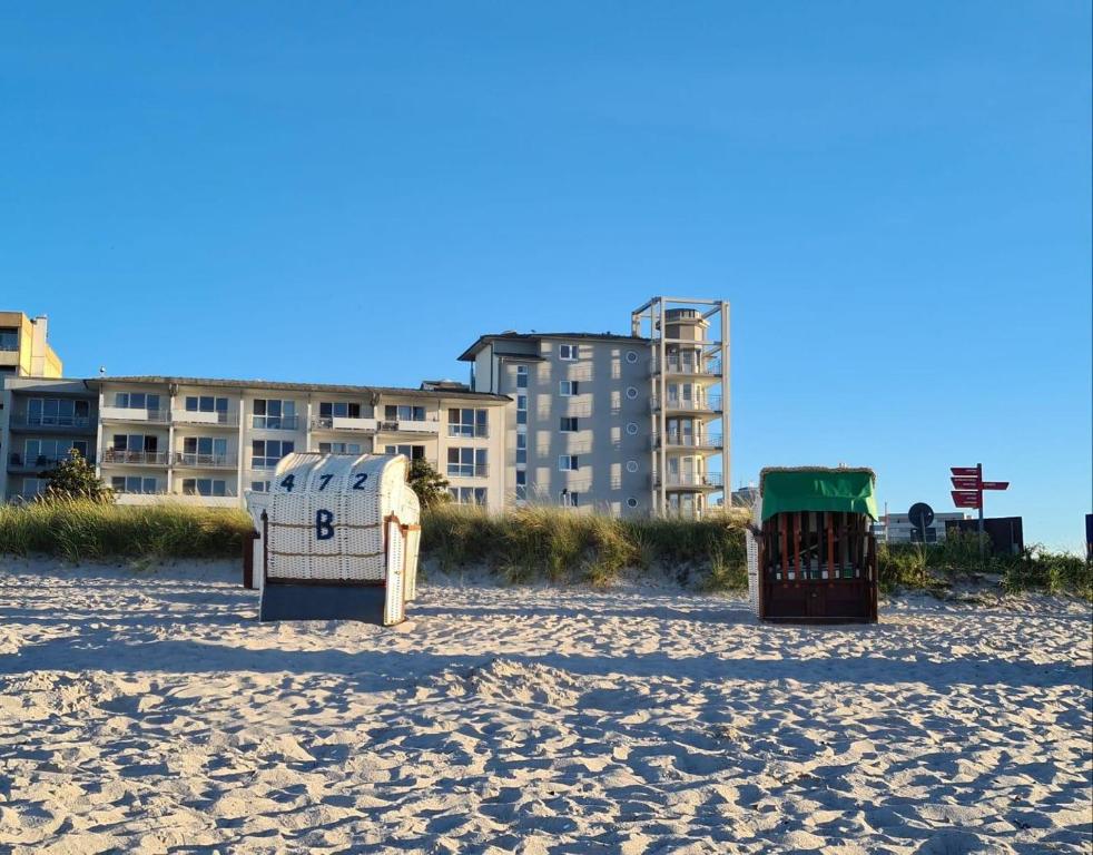 a beach with several things on the sand at Appartementhaus Ostseeresidenz in Heiligenhafen