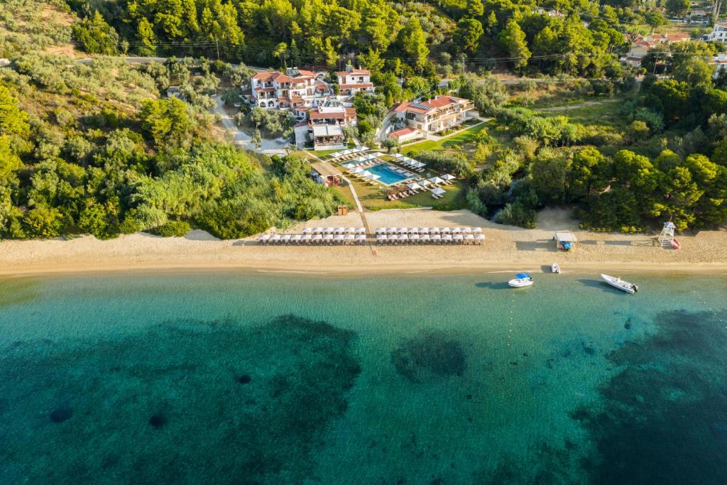 an aerial view of a beach with boats in the water at Dome Island in Troulos