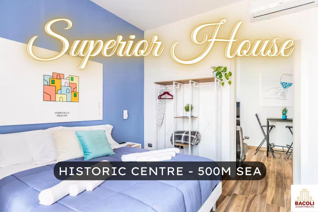 a bedroom with a bed and a sign that reads superior house at Bacoli House Superior - Central & Elegant Design in Bacoli