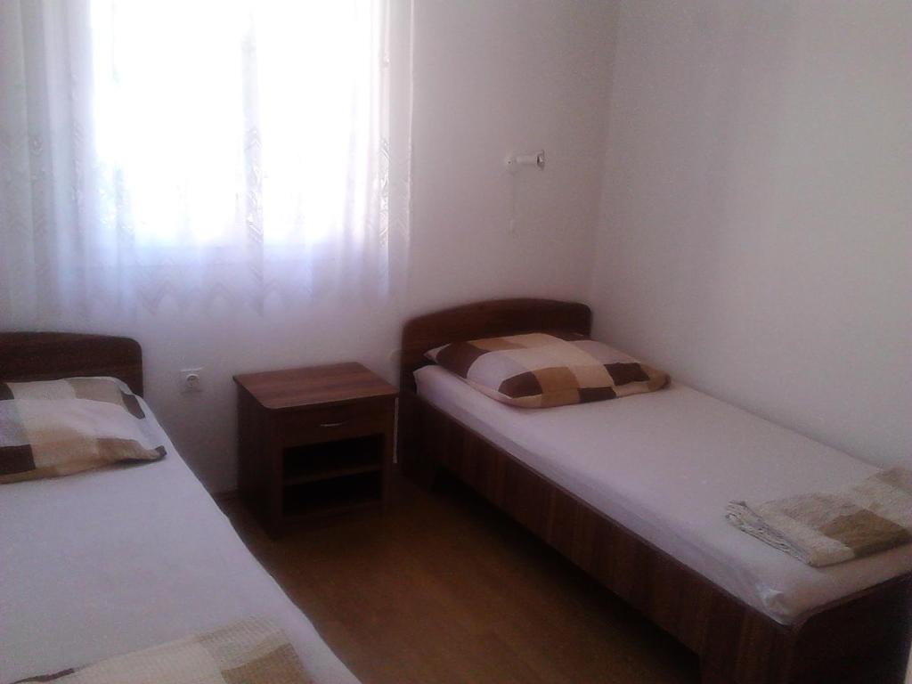 Postel nebo postele na pokoji v ubytování Apartman Vladić