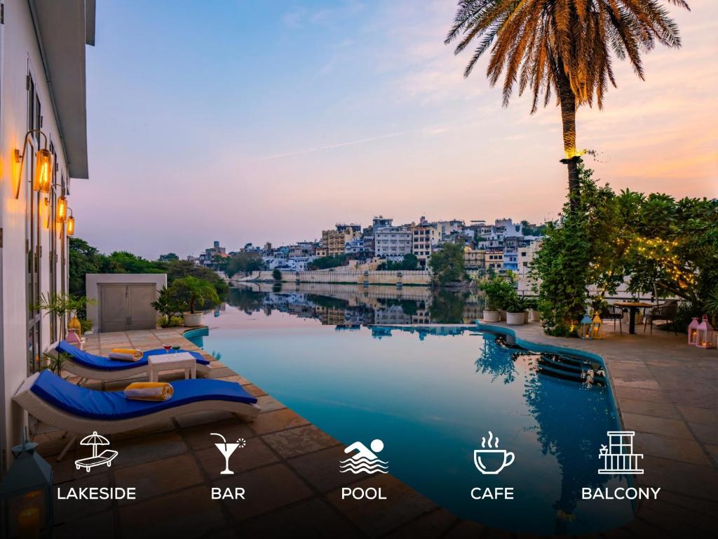 a pool with a view of a city at Moustache Udaipur Verandah in Udaipur