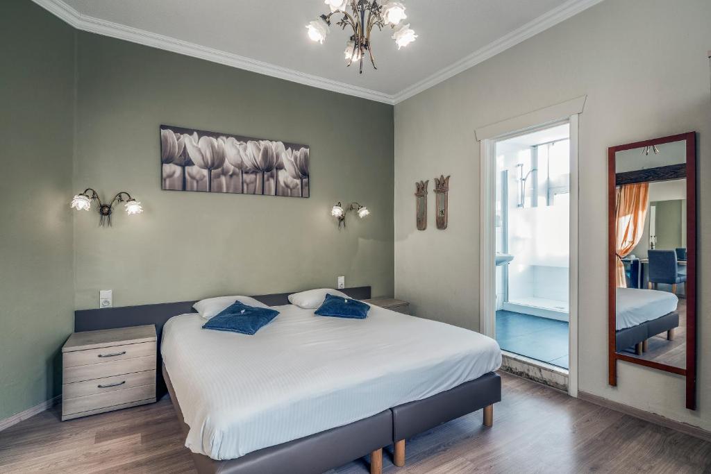 Postel nebo postele na pokoji v ubytování New Hotel de Lives