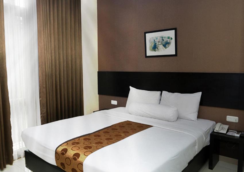 Postelja oz. postelje v sobi nastanitve Vio Hotel Pasteur
