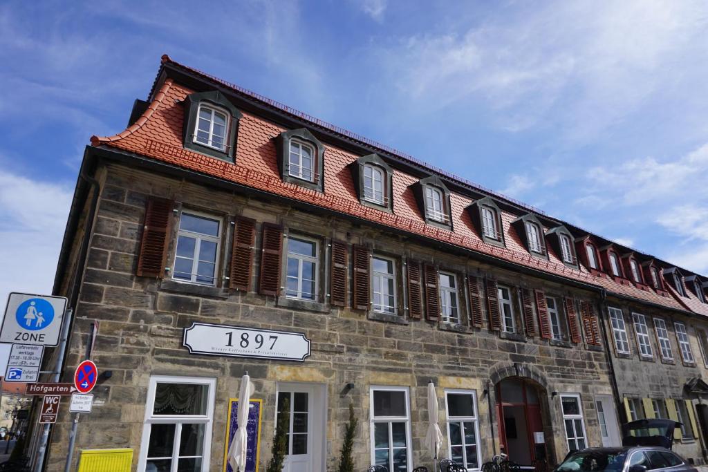 a building with a sign in front of it at Ludwig9 in Bayreuth