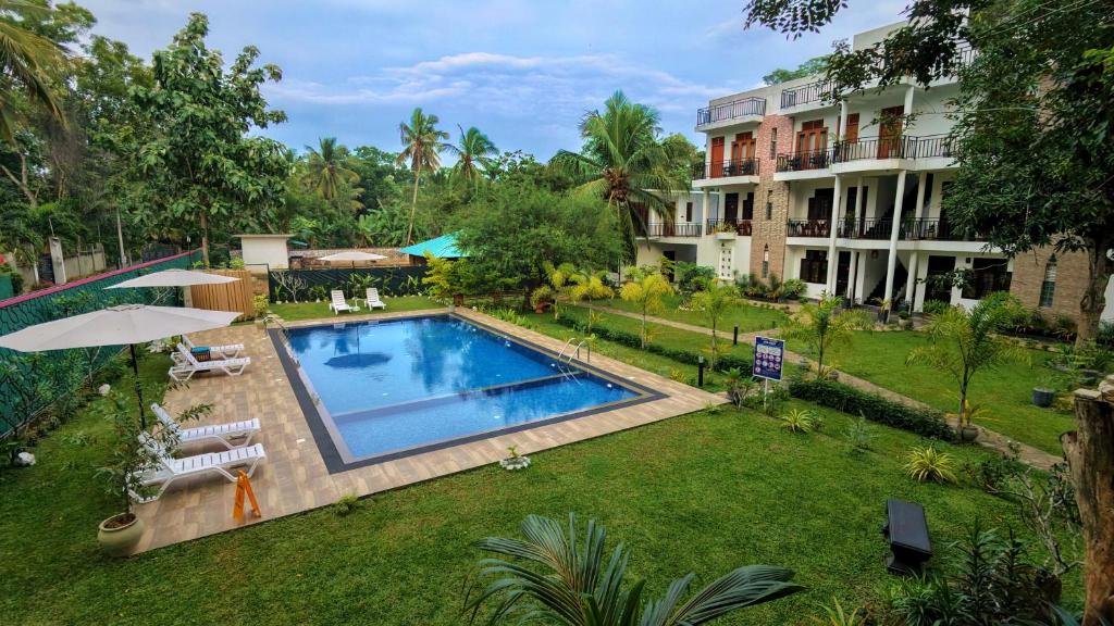 an aerial view of a yard with a swimming pool at Grand Toscana in Udawalawe