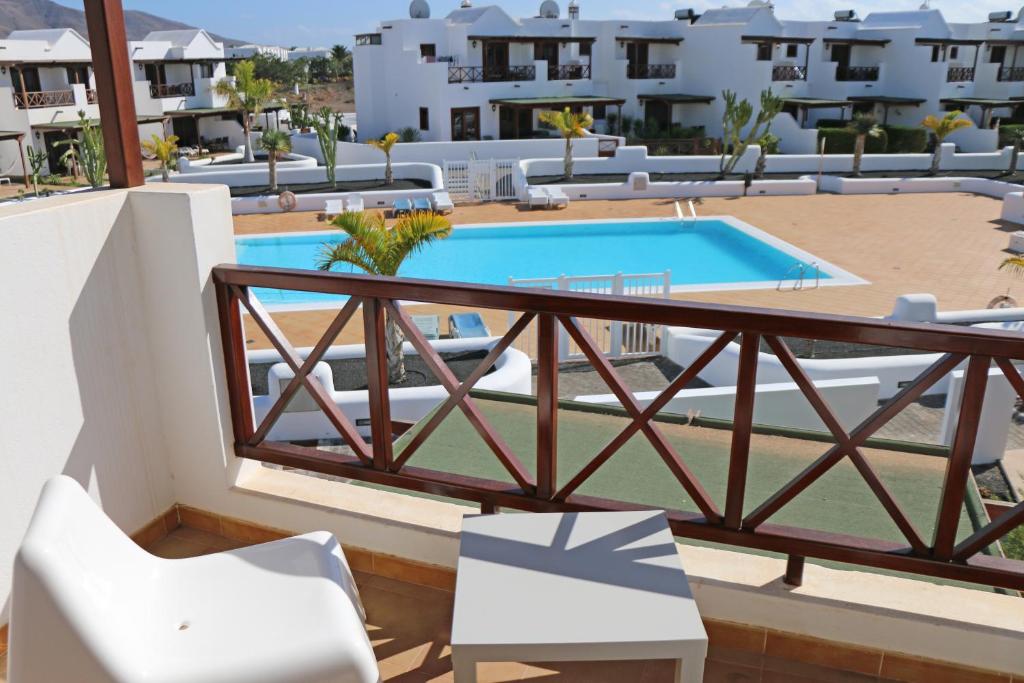 a view from the balcony of a hotel with a swimming pool at Apartamento Villa Laura in Playa Blanca