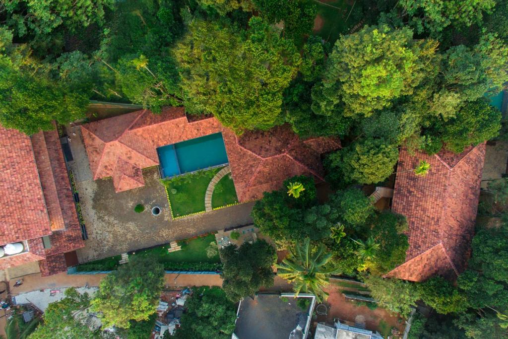 an overhead view of a house in a forest at Vynza Resort Vythiri in Vythiri