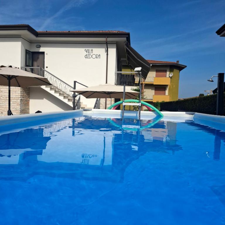a swimming pool in front of a building at Villa Azdora in Peschiera del Garda