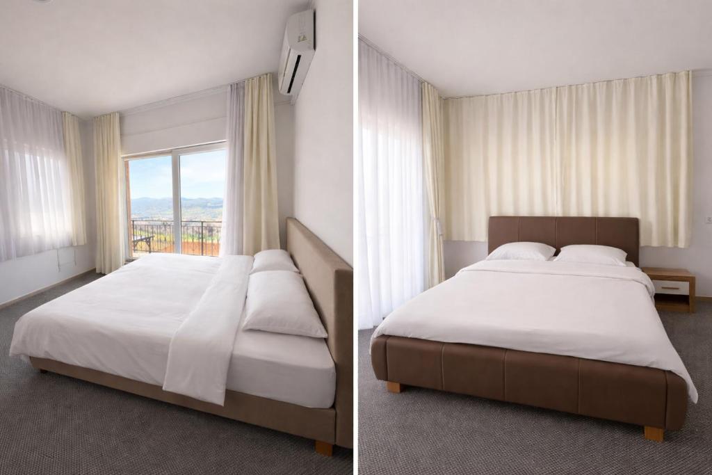 a bedroom with two beds and a large window at Prestige Deluxe View Villa in Ilijaš