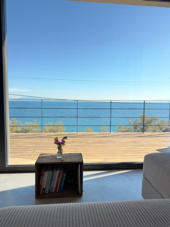 a living room with a large view of a large window at A House with A View in Plomari
