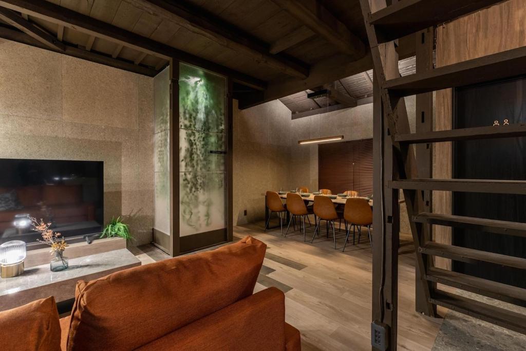 a dining room with a table and chairs at Betsuan Private Villa in Kuwana