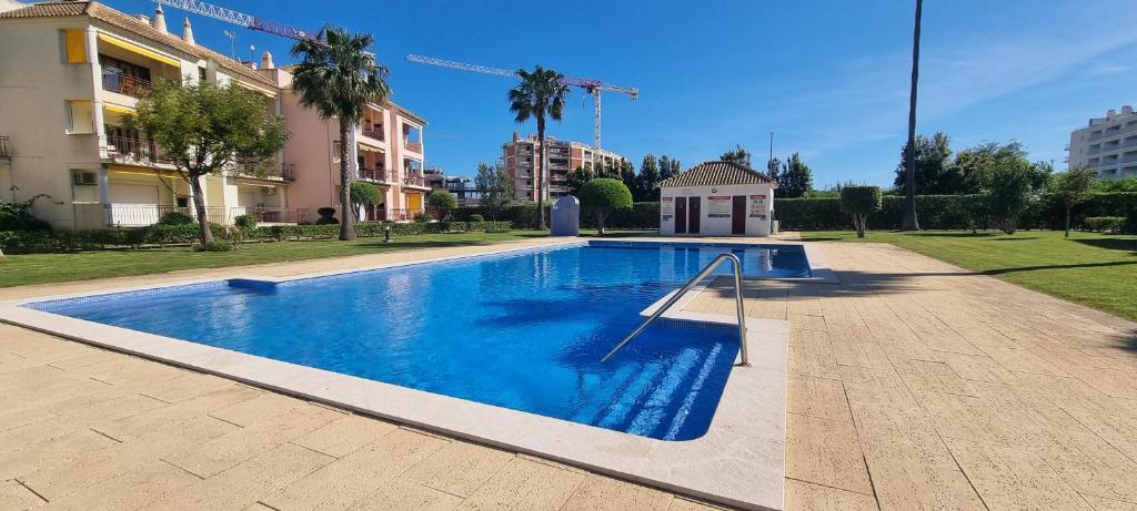 a swimming pool in the middle of a city at Dunas de vilamoura in Quarteira