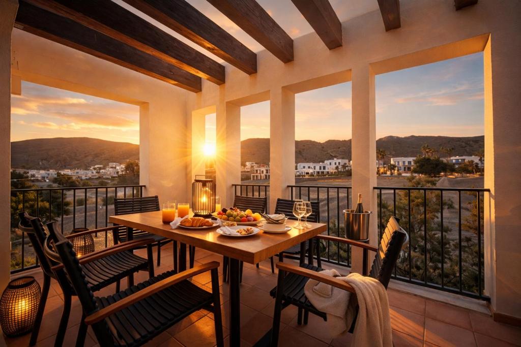 a dining room with a table and chairs on a balcony at Starfish Mojácar in Mojácar