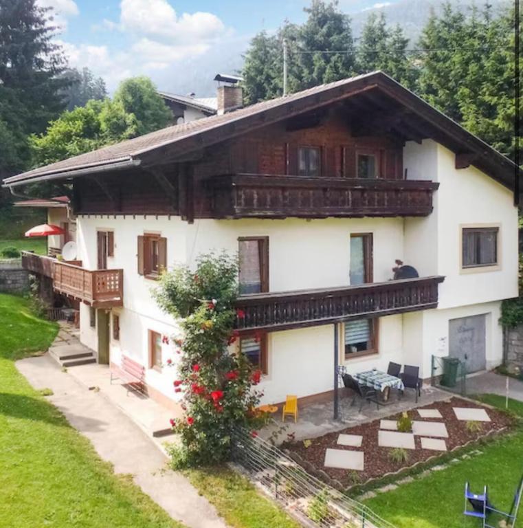 a large white house with a balcony at Ute Urbaner in Irschen