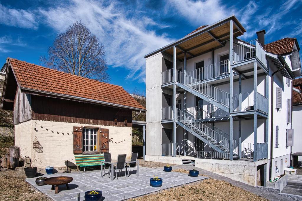 a house with a patio in front of it at Casa Carmela in Solothurn