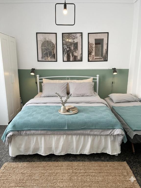 a bedroom with a bed with a tray with flowers on it at Dimi Guest House in Perea