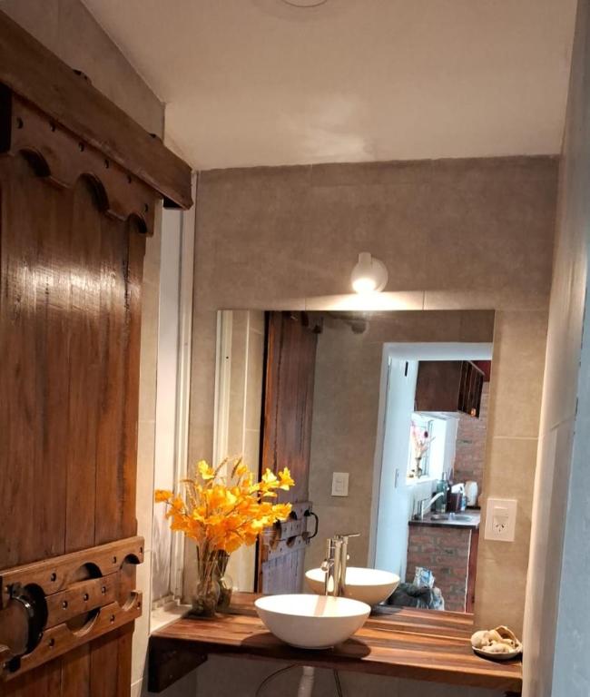 a bathroom with two sinks on a counter with a mirror at Anam Cara in Isla del Rincón