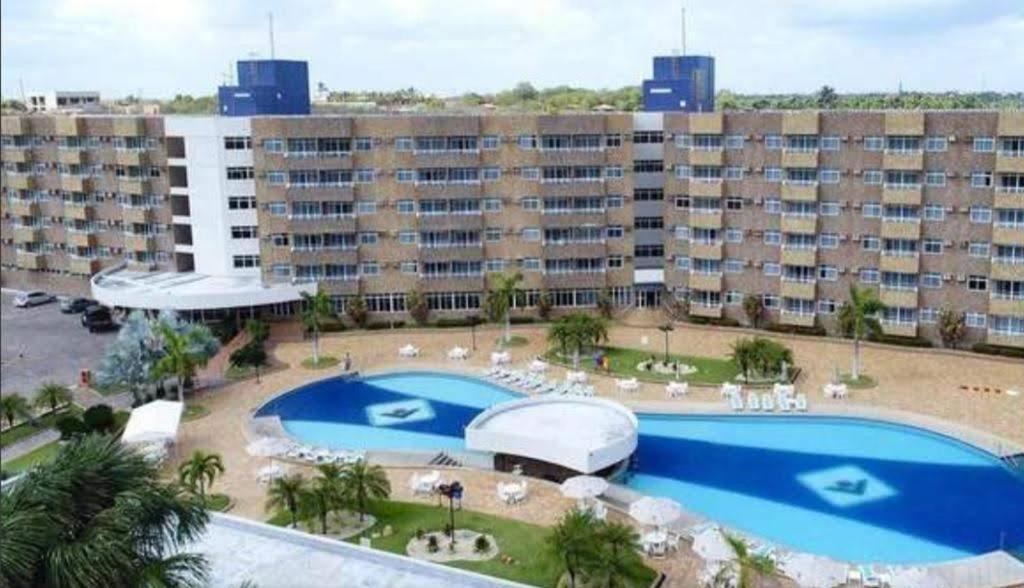 a large apartment building with a large swimming pool at Gran Lençóis in Barreirinhas