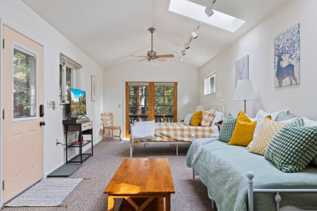 a living room with a couch and a table at Cresta Loft in Twain Harte