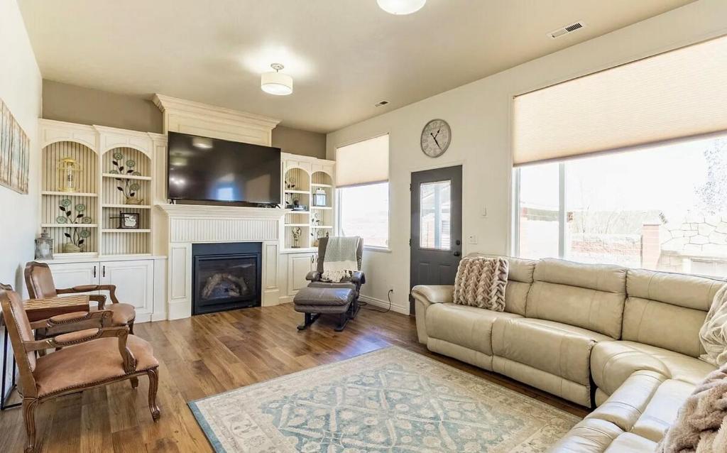 a living room with a couch and a fireplace at Fossil Crest Retreat in Vernal