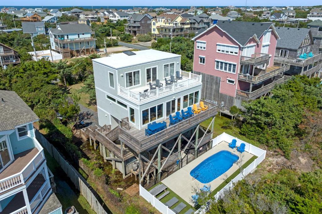 an aerial view of a house with a swimming pool at Crabcake Village OBX in Salvo