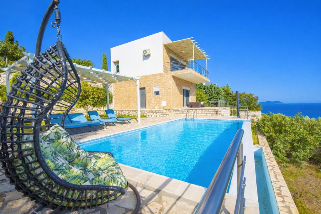 a villa with a swimming pool and a slide at Villa Faneromeni in Lefkada