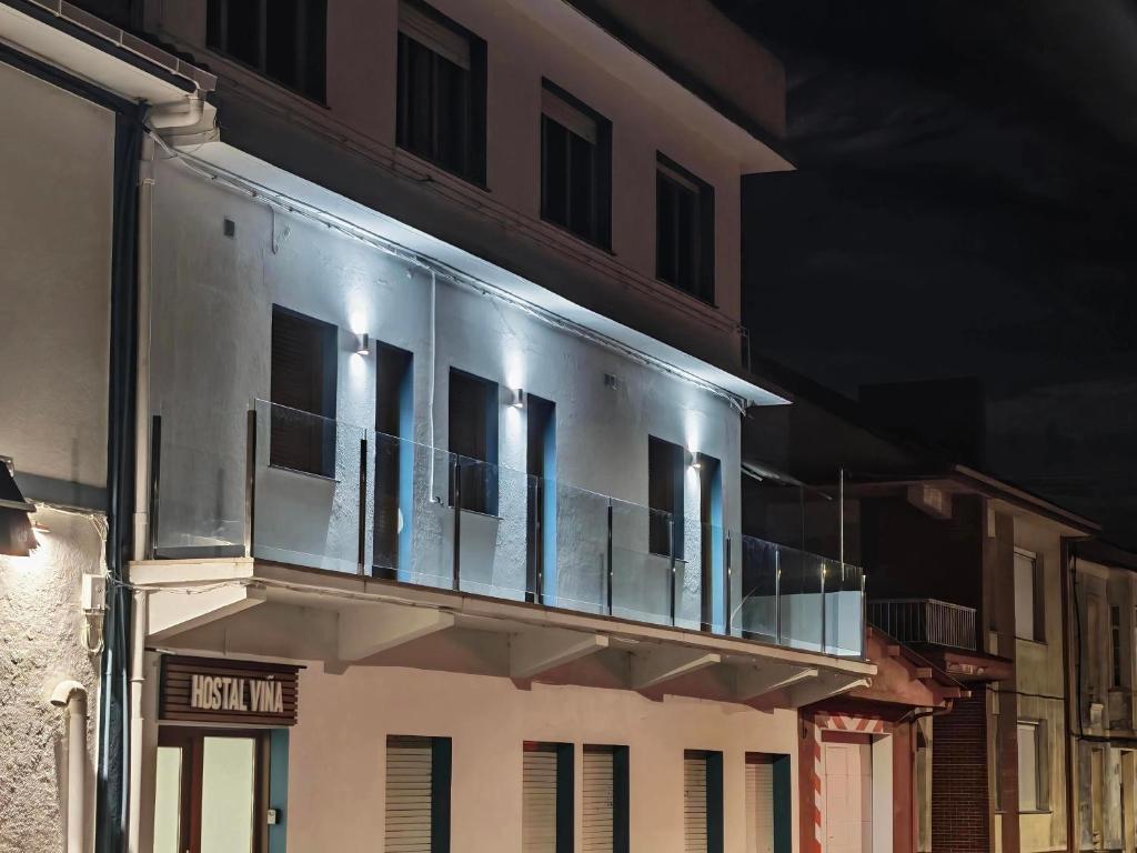 a balcony on the side of a building at Hostal Viña in Outes