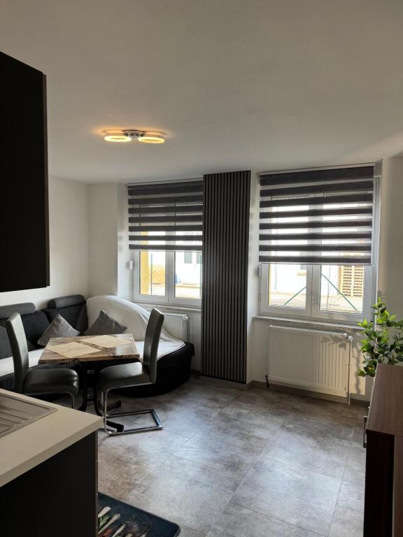 a living room with a couch and a table at Hellwig Ferienwohnung 5 in Bernburg