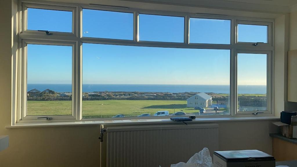 a window in a room with a view of the ocean at Apartment 2 Maritime House in Portland
