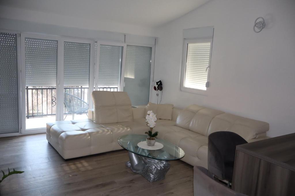 a living room with a couch and a table at Apartman SASHA in Bar