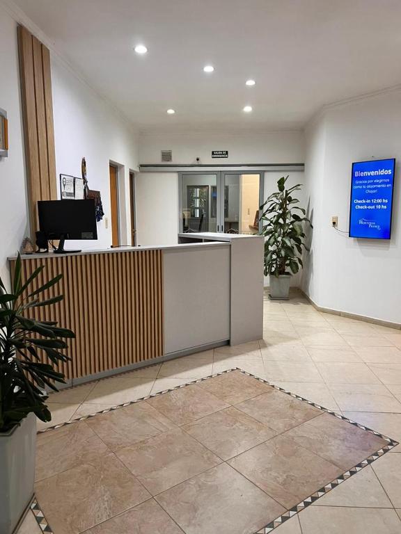 a lobby with a reception desk in a building at Hosteria Prince in Chajarí