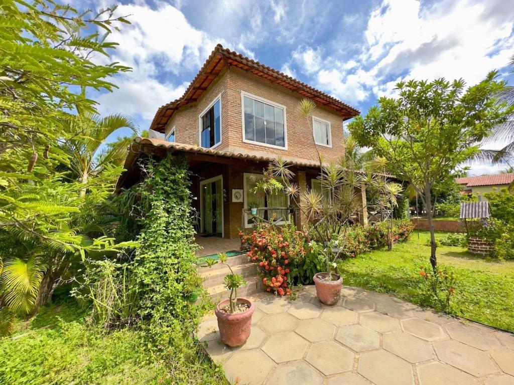 a house with plants in front of it at Sitio Mãe Rainha in Petrolina