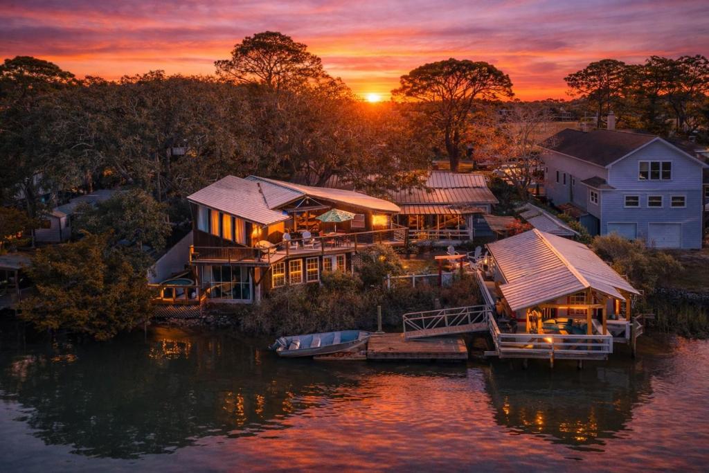 an aerial view of a house on the water at sunset at Creekside Paradise in Tybee Island