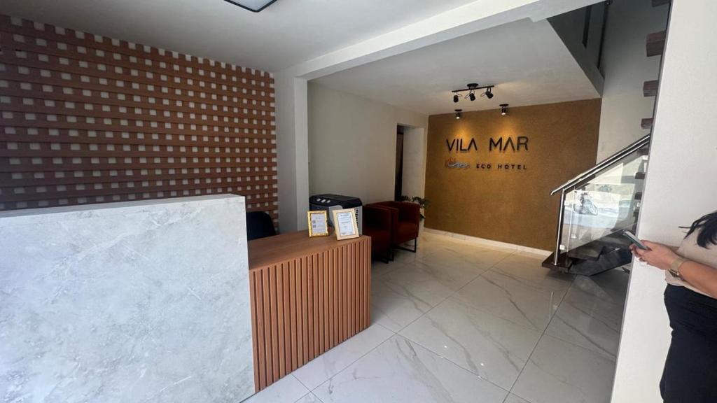 a person taking a picture of the lobby of a salon at Vila Mar Eco Hotel in Parnaíba