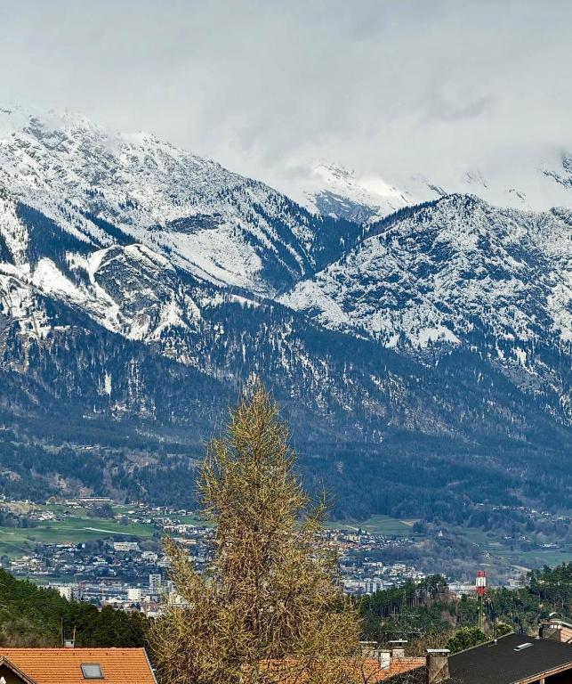 a view of a mountain with snow covered mountains at Apartment Central Mutters Innsbruck in Innsbruck