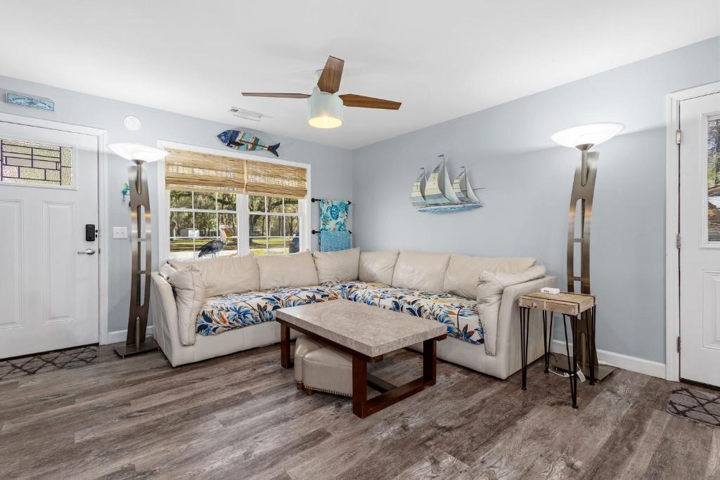 a living room with a couch and a table at Sailors Delight in Beaufort