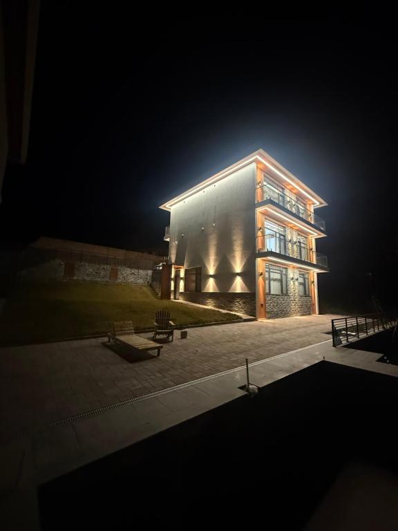 a large building at night with a spotlight on it at Mountain sight Villa in Sheki