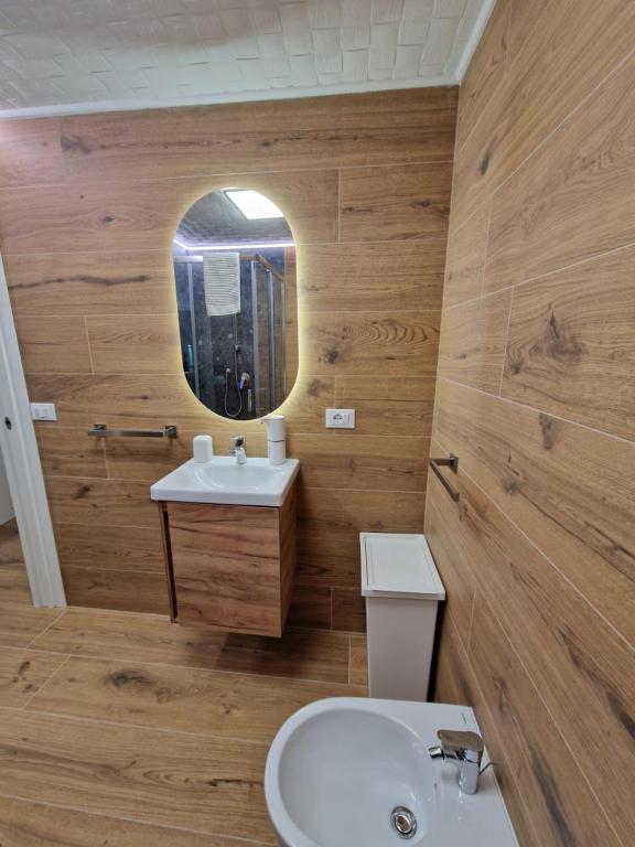 a bathroom with a sink and a mirror at VENEZIA Playa in Chioggia