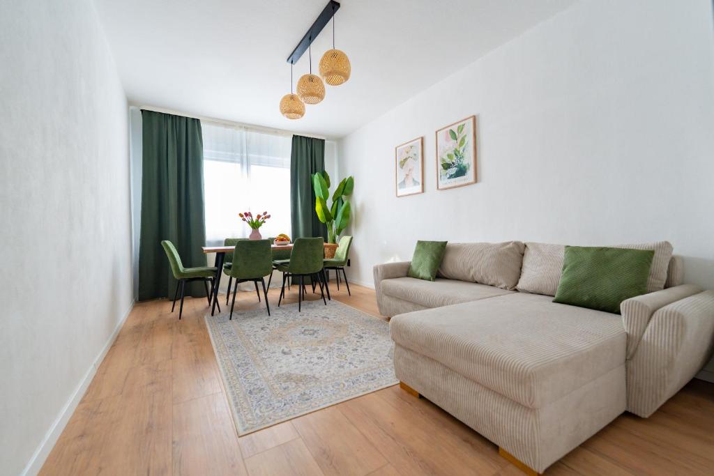 a living room with a couch and a table at Wohnung in Essen in Essen