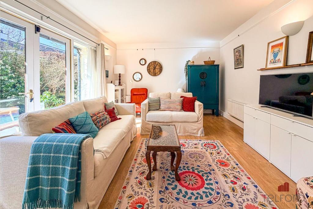 a living room with a couch and a table at Woodlodge Retreat in Holywood