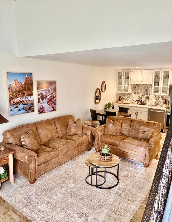 a living room with a couch and a table at Eagles Roost Haven - Cozy Ski View Condo in Brian Head