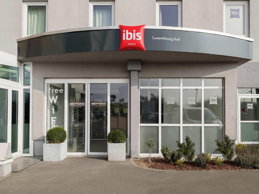 a building with a ups sign in front of it at ibis Luxembourg Sud in Livange