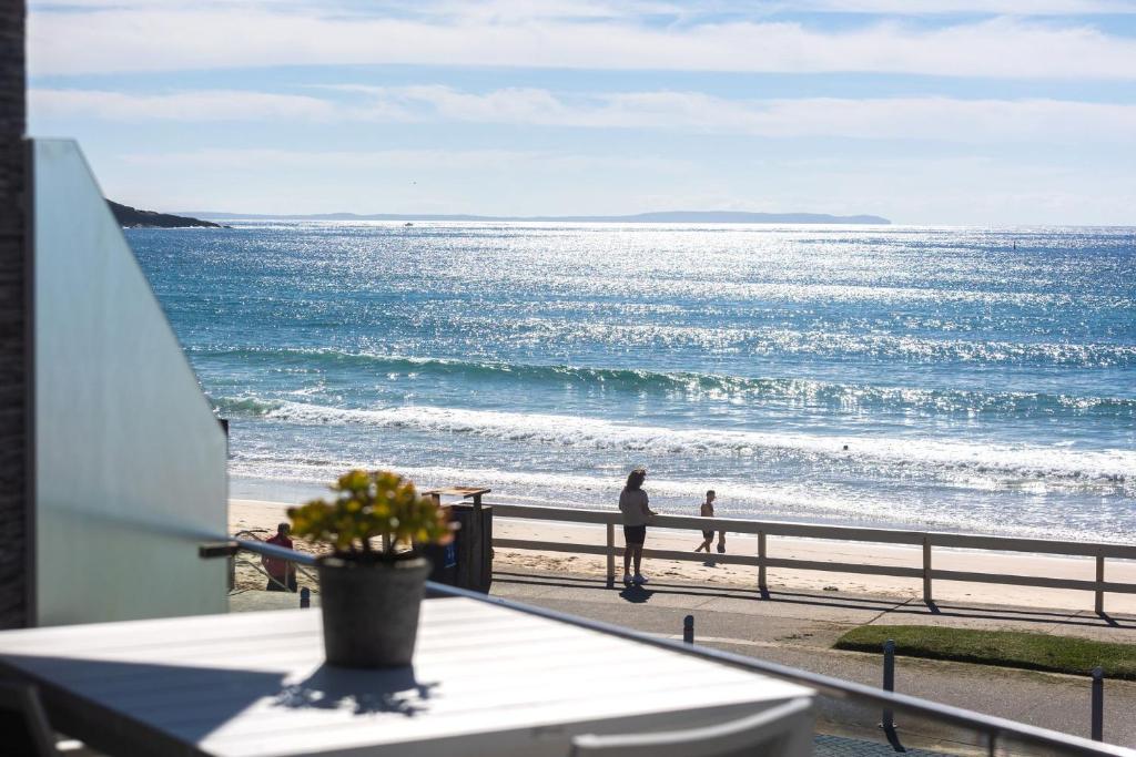 a view of the ocean from a balcony of a beach at Mariners 5 in Mollymook